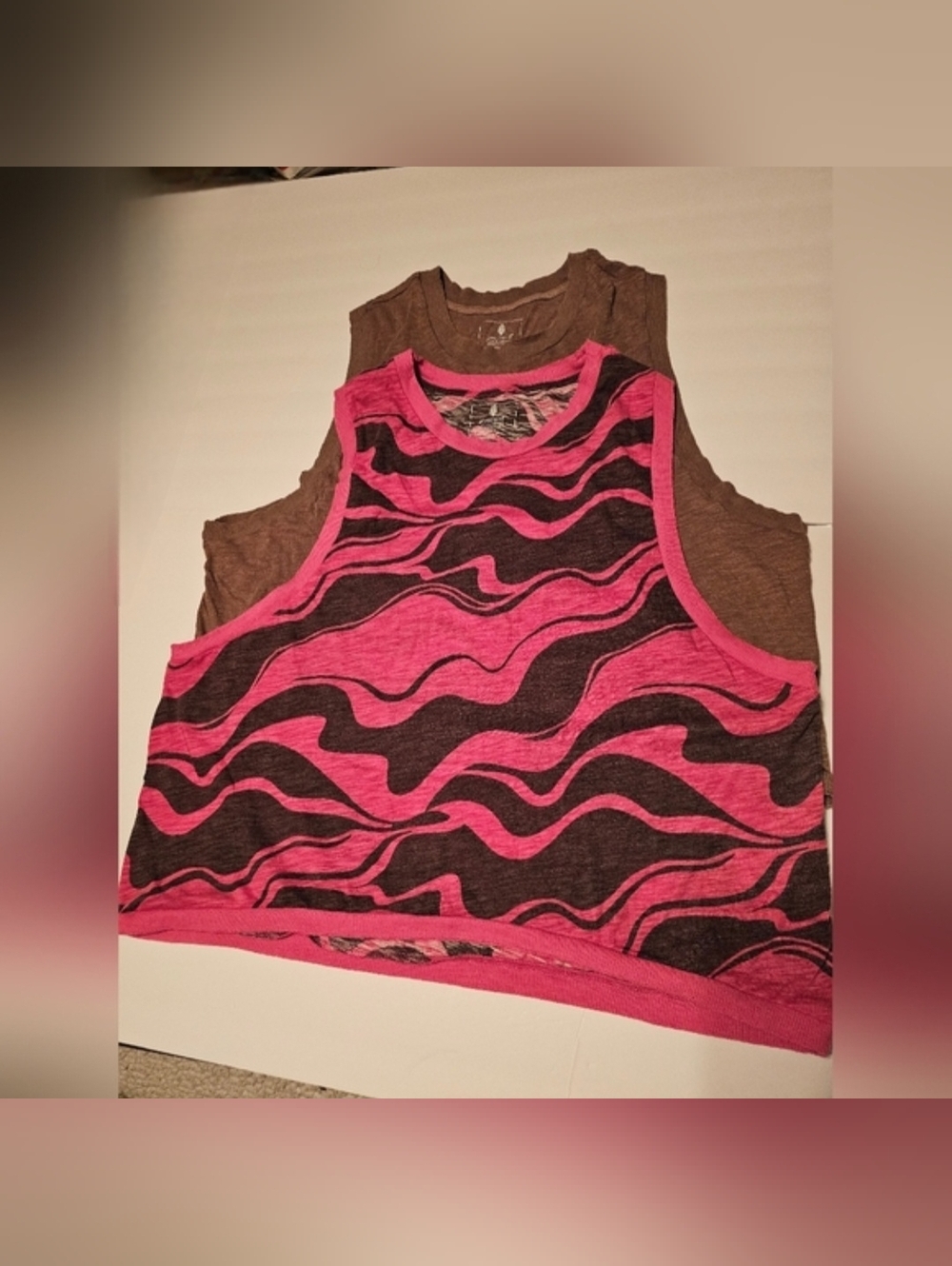 2 FP  Movement Tanks 1- Tan Tank Top & 1- Pink& Black Tank Top.